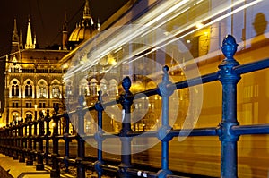 Night tram heading the Parliament Building, Budapest, Hungary