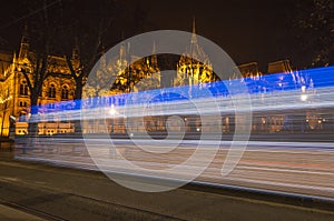 Night tram heading the Parliament Building, Budapest, Hungary