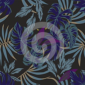 Night tropical leaves pattern with eyes in the middle