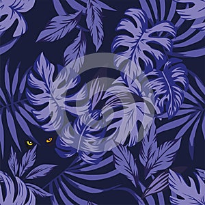 Night tropical leaves pattern with eyes panther photo