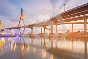 Night twilight suspension bridge and interchange highway