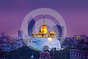Night Urban City Skyline, Saket Temple (Golden mountain), Landmark of Bangkok, Thailand. photo