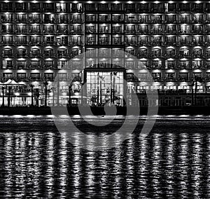 Night urban scene with reflections on a water,night city with reflections in water, night urban fragment photo, conceptual photo,