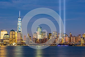 Night view of the 911 memorial light and the New York City skyline