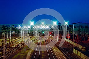 Night view from above on the railway. Commodity trains, freight wagons and cisterns