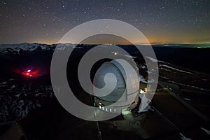 Night view from above to the large dome of the telescope of the special astrophysical observatory in the Arkhyz mountains