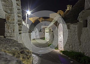 Night view of an alley in Alberobello, south of Italy