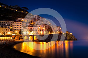 Night view of Amalfi on coast line of mediterranean sea, Italy