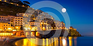 Night view of Amalfi on coast line of mediterranean sea, Italy