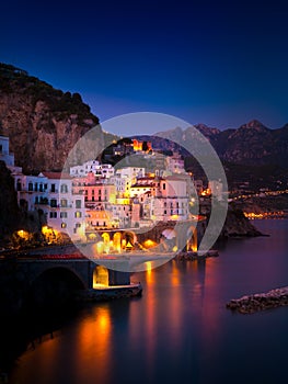 Night view of Amalfi on coast line of mediterranean sea, Italy