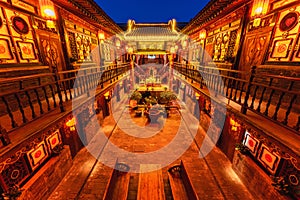 Night view of ancient Chinese traditional residential buildings in Pingyao old Town, Shanxi, China