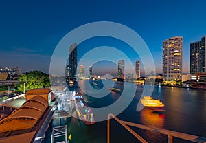 Night view of Bangkok at Saphan Taksin pier,Thailand