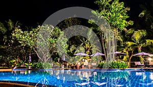 Night view of beautiful swimming pool in tropical resort , Koh C