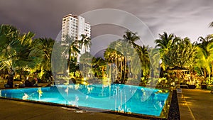 Night view of beautiful swimming pool in tropical resort , Phuket