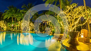 Night view of beautiful swimming pool in tropical resort , Phuket