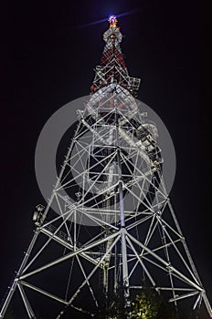 Night view from below of television tower located on the on the slope of High castle in Lviv