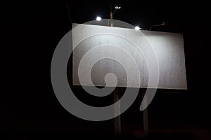 Night View Of Big Billboard Illuminated By Lanterns.