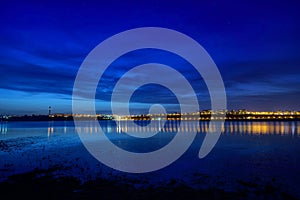 Night view at blue hour of Galati City, Romania with reflections