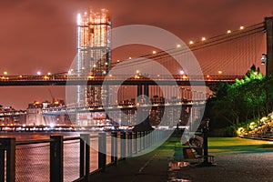 Night view of Brooklyn Bridge and Lower Manhattan skyline from Brooklyn Bridge Park in New York City