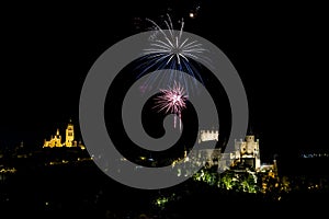 night view of the castle and the cathedral of segovia with fireworks