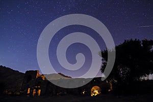 Night view of the castle. A view of the stars of the Milky Way with a mountain top in the foreground. Night sky nature summer land