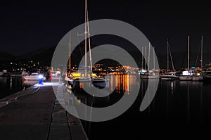 Night view of the catamaran and yacht