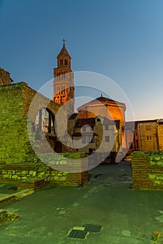 Night view of the Cathedral of Saint Domnius viewed behind ruins of Diocletian palace in Split, Croatia