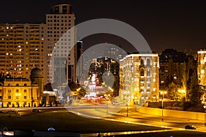 Night view of the center of Baku. movement of cars through the night city. Skyscrapers, high-rise buildings and automobile
