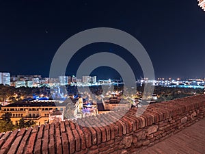 Night view of the city hall, the park, Muelle Uno and the port of Malaga, Spain at night