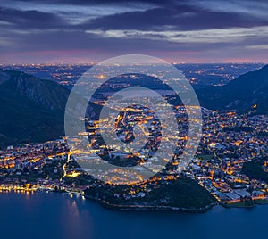 Night view of the cityValmadrera and lake Annone photo