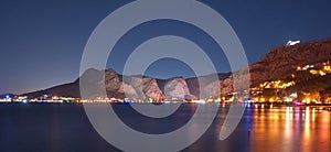 Night view of coastal town of Omis