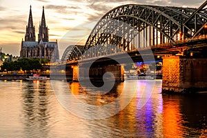 Cologne Cathedral and Hohenzollern Bridge at sunset, Germany