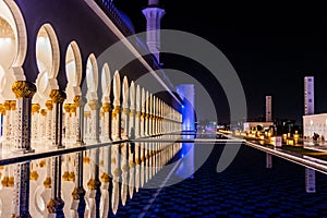 Night view of the colonnade of Sheikh Zayed Grand Mosque in Abu Dhabi, United Arab Emirate