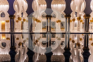 Night view of the colonnade of Sheikh Zayed Grand Mosque in Abu Dhabi, United Arab Emirate