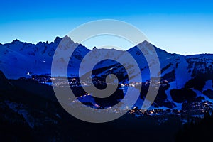 Night view of Courchevel village and ski slopes