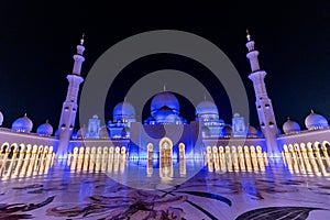 Night view of the courtyard of Sheikh Zayed Grand Mosque in Abu Dhabi, United Arab Emirate