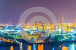 Night view of cranes in the port of hamburg, Germany