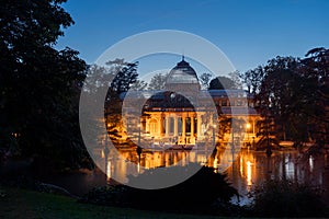 Night view of Crystal Palace or Palacio de cristal in Retiro Park in Madrid, Spain.