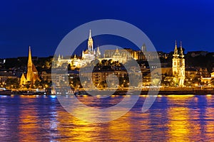view from the Danube river of the Mathias Church and Buda castle in Budapest