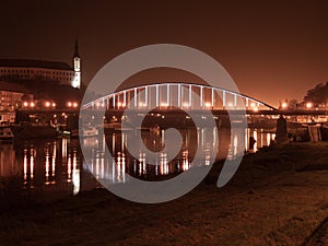 Night view of Decin Castle and Tyrs Bridge over Elbe River photo