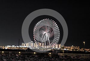 Night view of the decoratively illuminated Ferris wheel - The Dubai Eye - located on thef Dubai Marina in Dubai city, United Arab