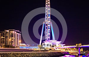 Night view of the decoratively illuminated Ferris wheel - The Dubai Eye - located on thef Dubai Marina in Dubai city, United Arab