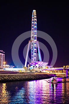 Night view of the decoratively illuminated Ferris wheel - The Dubai Eye - located on thef Dubai Marina in Dubai city, United Arab