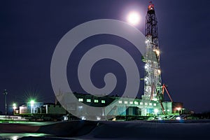 A night view of a derrick drilling in Siberia