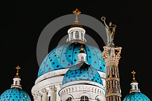 Night view domes with stars of the Troitsky Cathedral in Saint-Petersburg