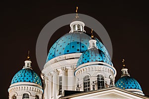 Night view domes with stars of the Troitsky Cathedral in Saint-Petersburg