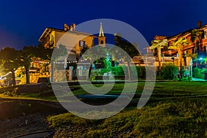 Night view of empty streets of Isola Superiore dei pescatori at Lago Maggiore, Italy