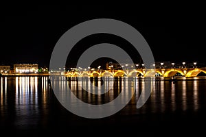 Night view of the famous bridge of Bordeaux called Le Pont de Pierre