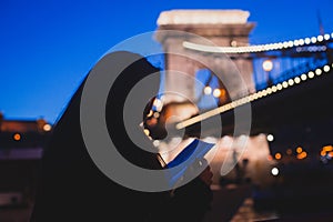 Night view of a famous Budapest Szechenyi Chain Bridge, a suspension bridge that spans the River Danube between Buda and Pest, the