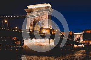 Night view of a famous Budapest Szechenyi Chain Bridge, a suspension bridge that spans the River Danube between Buda and Pest, the